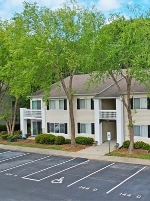 Exterior view of the Crescent Oaks facility with green surroundings