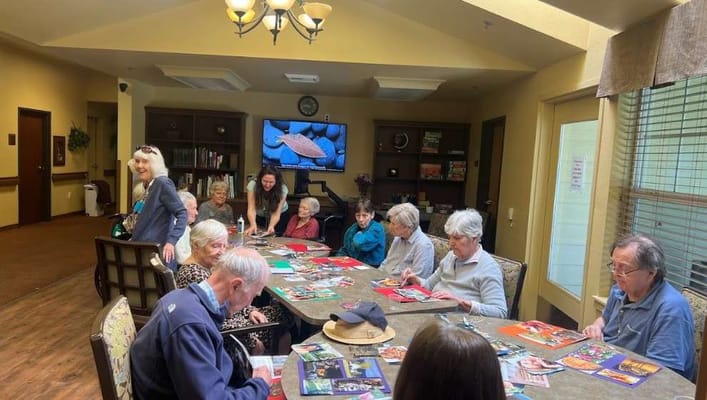 Residents engaged in a creative activity in the common area