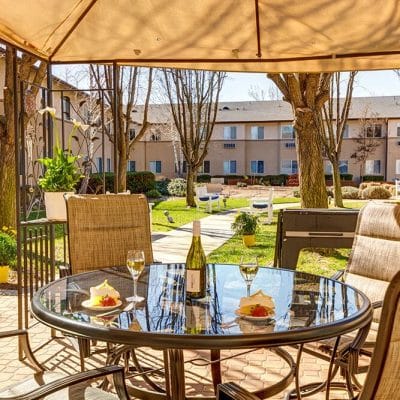 Outdoor dining area with a table and dessert