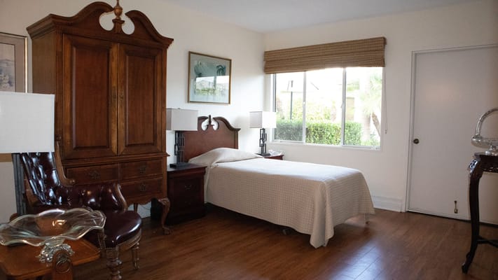 Cozy private room with bed and furniture