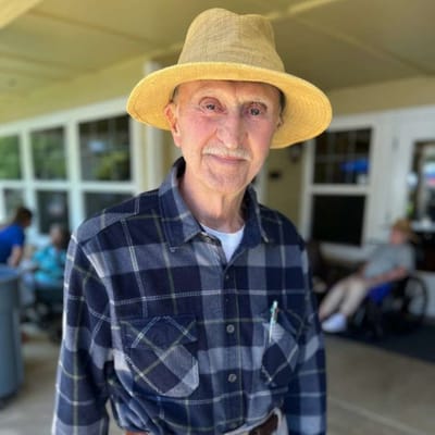 A resident enjoying time outdoors at Amber Grove Place