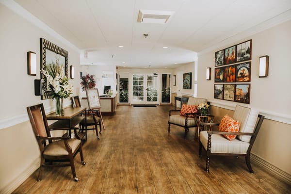 A bright common area with seating and decorations