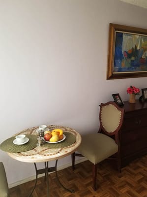 Cozy dining setup with fruit on the table