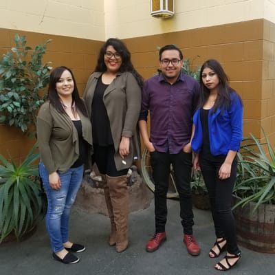 Staff members posing together indoors