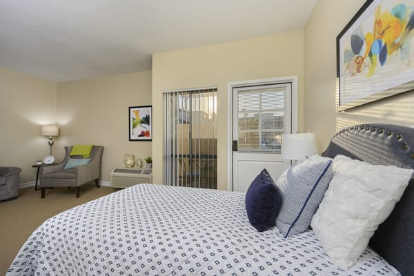 A well-furnished resident room with natural light