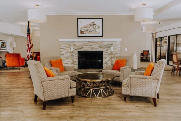 Cozy seating area with orange accents in a common space