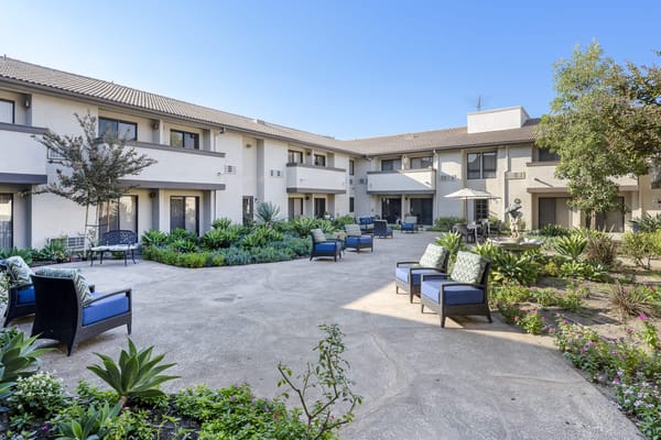 Outdoor courtyard with seating and gardens