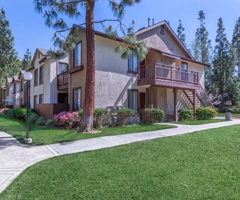 Exterior view of a senior living facility with landscaped grounds