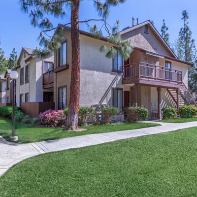 Exterior view of a senior living facility with landscaped grounds