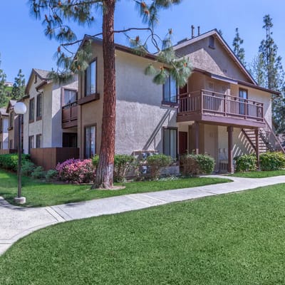 Exterior view of a senior living facility with landscaped grounds