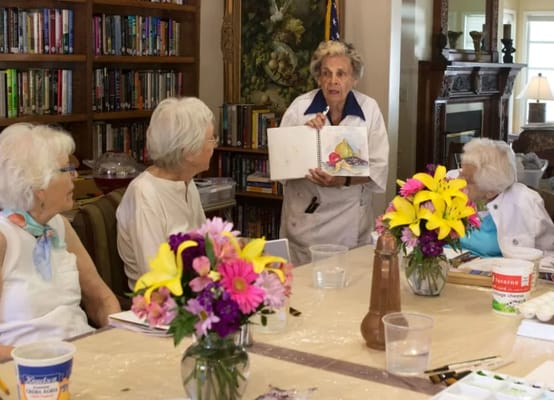 Residents participating in an art activity in a common area