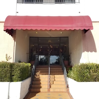 Entrance to Fine Gold Manor with awning