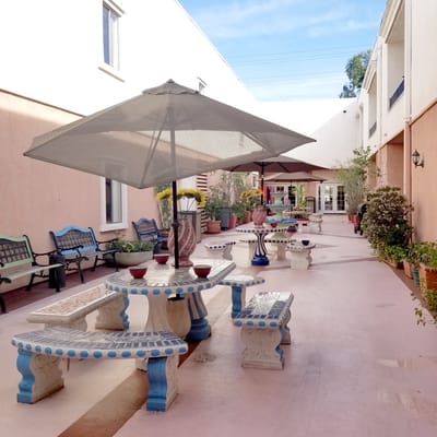 Outdoor courtyard area with benches and umbrellas