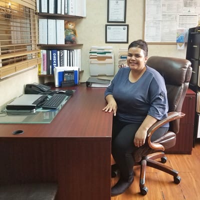 Staff member in an office setting at the facility