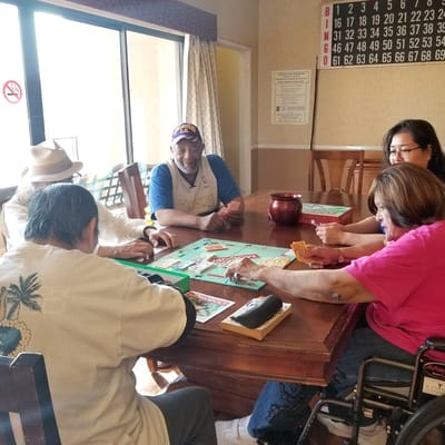 Residents engaged in a board game activity