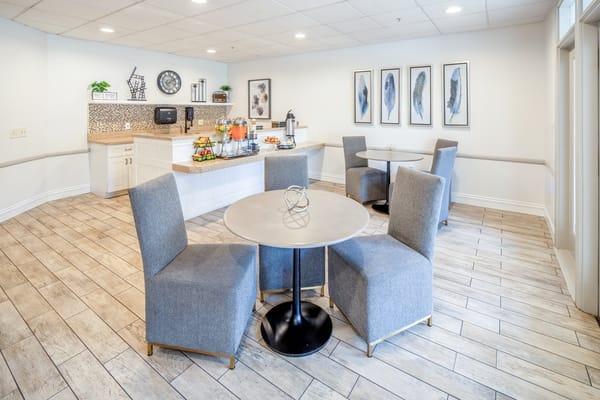 Bright dining area with tables and refreshments