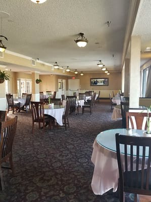 Dining room with tables set for residents