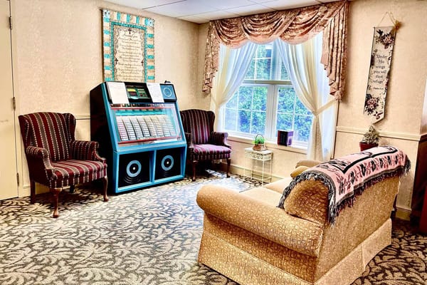 Cozy lounge area with a jukebox and seating