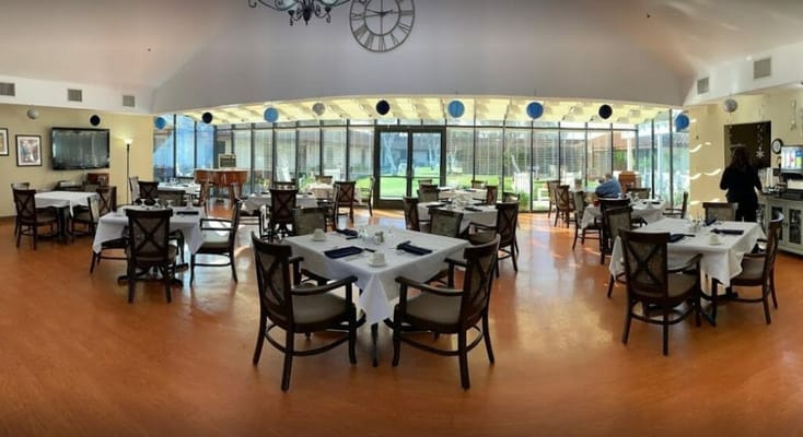 Dining area with tables and outdoor views