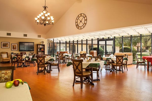 Bright dining area with tables and chairs