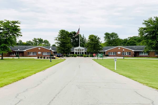 Exterior view of Grace Retirement Village with landscaped grounds