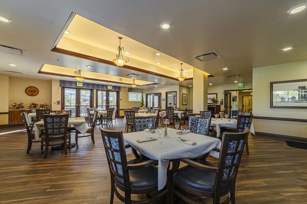 Dining area with set tables and natural lighting