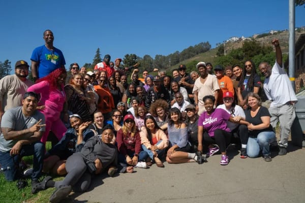 Large group of staff and residents at an outdoor event