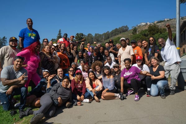 Large group of staff and residents at an outdoor event