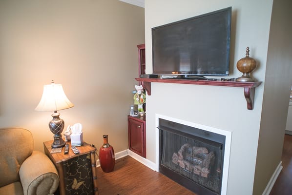 Cozy lounge area with a TV and lamp