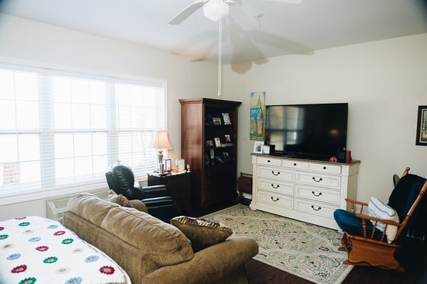 Cozy interior of a resident's room with furniture and decor