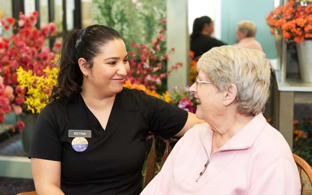 Staff member engaging warmly with a resident
