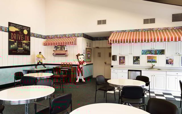 Interior view of a themed dining area with tables and decor