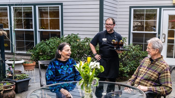 Residents enjoying conversation in an outdoor space
