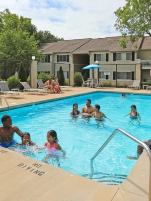 Residents enjoying a sunny day by the pool