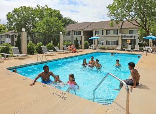Residents and children enjoying the pool area