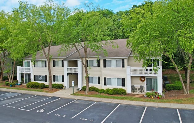 Exterior view of Crescent Oaks facility with green landscape