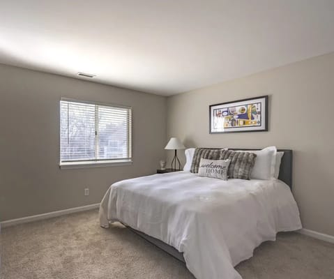 Bright bedroom setup with welcoming decor.