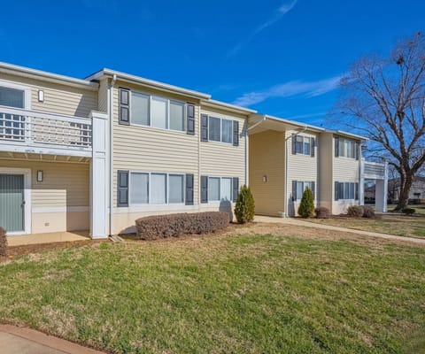 Exterior view of Crescent Oaks building with landscaping