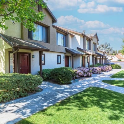 Well-maintained pathway and garden areas outside the facility