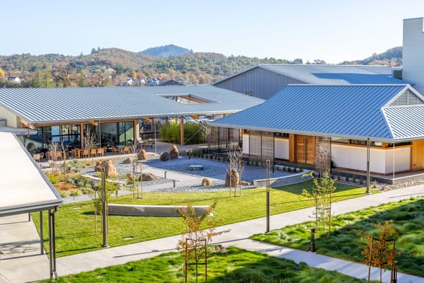 Outdoor area featuring landscaped gardens and pathways