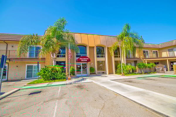 Front exterior of Fullerton Villa with palm trees