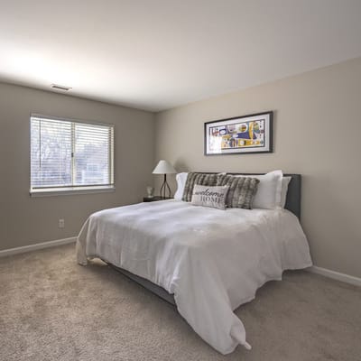 Cozy bedroom with a welcome home sign