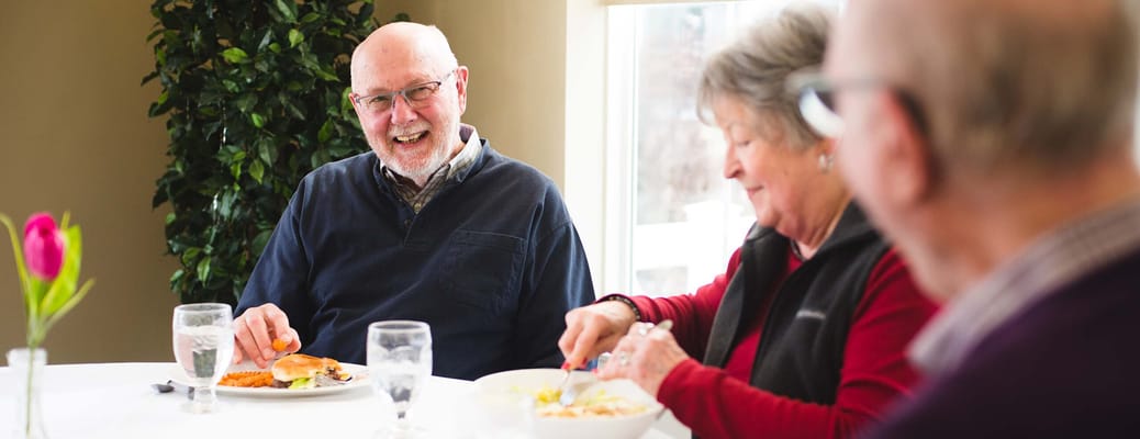 Residents enjoying a meal in the dining room
