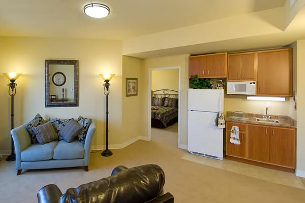 View of a cozy resident suite with kitchenette
