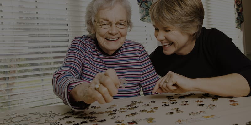 Residents enjoying a puzzle activity together