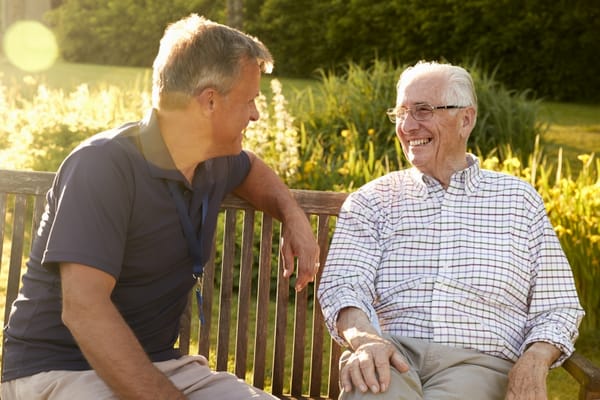 Staff member engaging with a resident outdoors