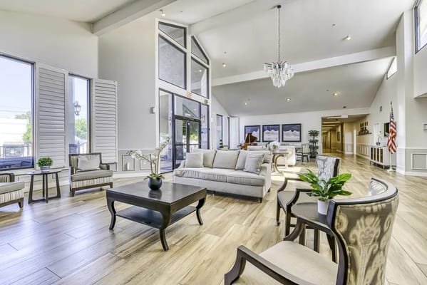 Bright common area with seating in a senior living facility