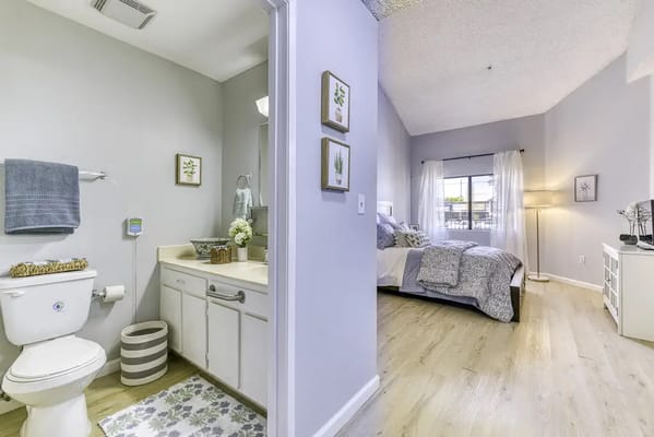 Interior view of a private resident room with bathroom