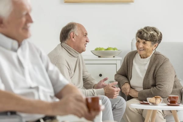 Two residents having a conversation in a common area