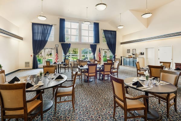 Interior view of a dining area with tables and chairs
